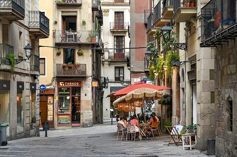 A street with a café terrace in Ciutat Vella